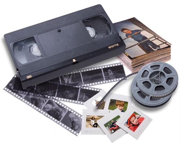 A VHS tape, 8mm film reels, film negatives, and old family photo prints